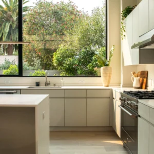 Bright kitchen with a compact island, counter stool and large window