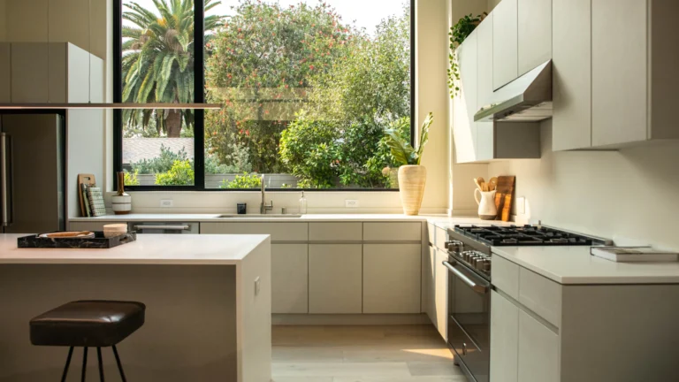 Bright kitchen with a compact island, counter stool and large window