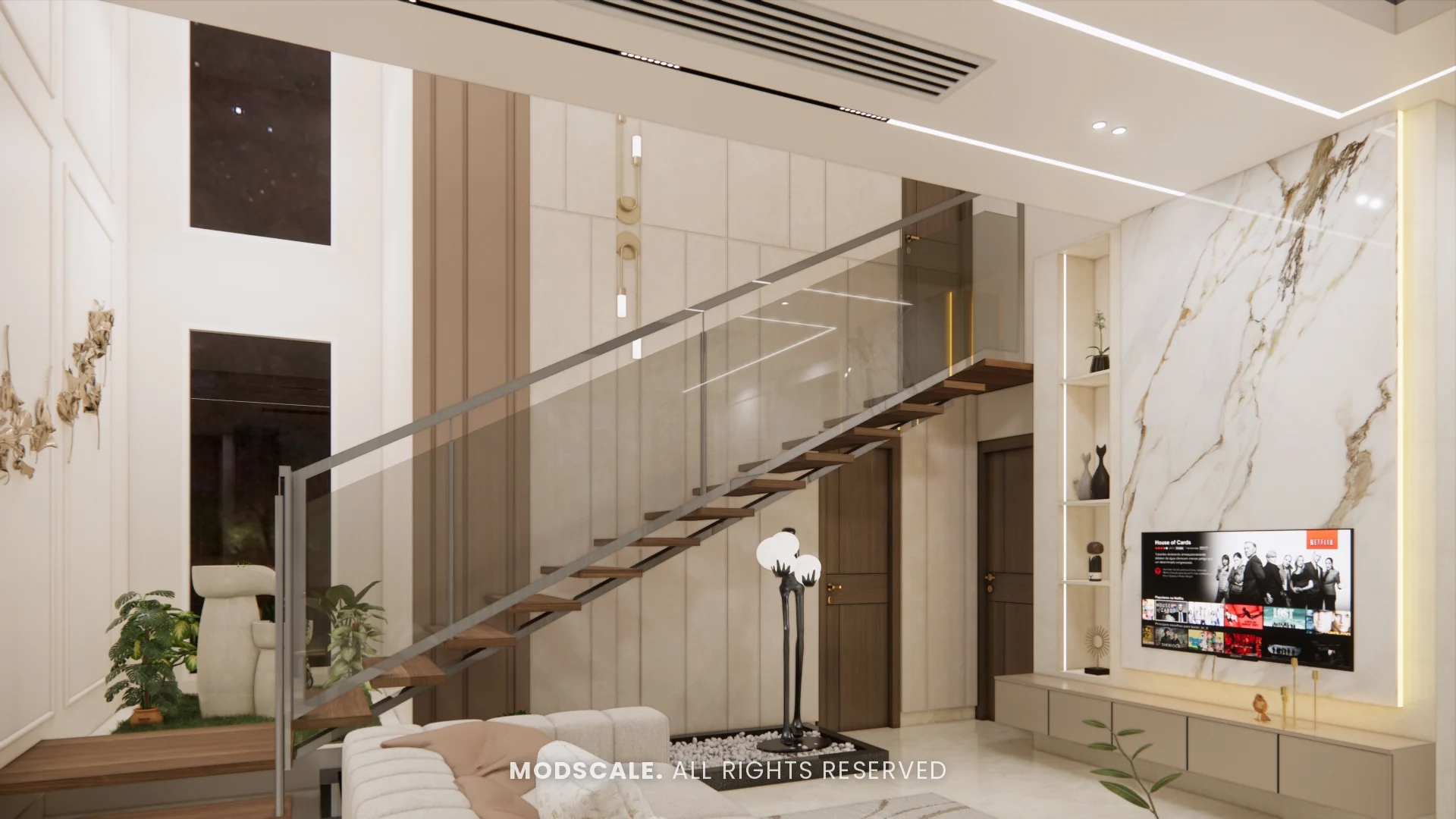 Double-height TV wall with brass wall sculpture and floating staircase, Mukesh’s villa interior on Sarjapur Road