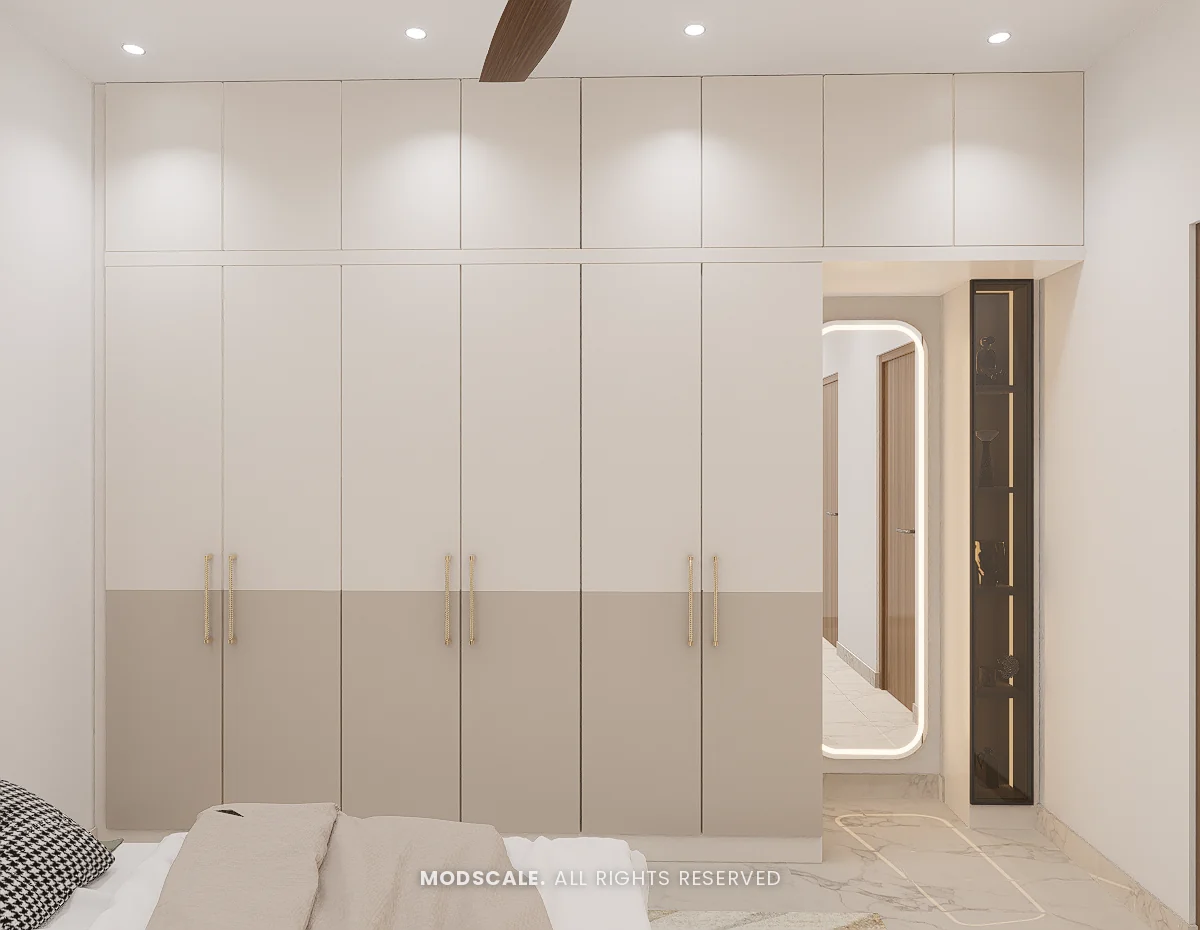 Full-wall white wardrobe with beige base band and lit mirror, Praveen’s villa interior at Springville, Harlur, Bengaluru