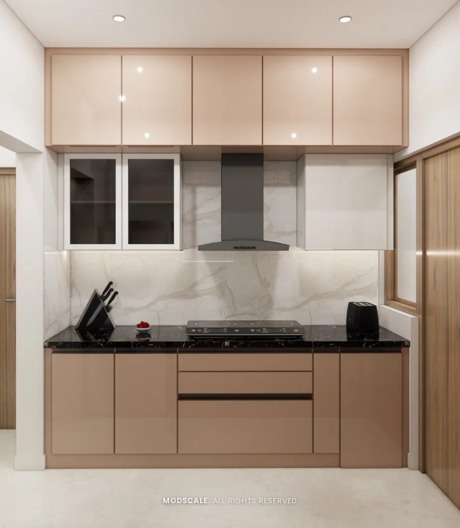 Parallel modular kitchen with blush gloss cabinets and black counter, Rahul Rao’s apartment interior in Ramagondanahalli