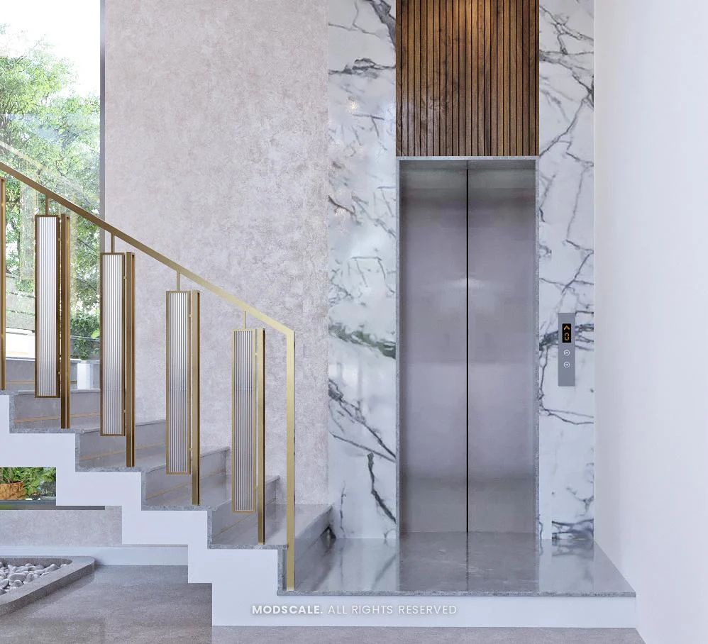 Home lift set in a marble wall at the foot of the staircase, Shankar’s villa interior at Royal Meridian Layout, Begur, Bengaluru