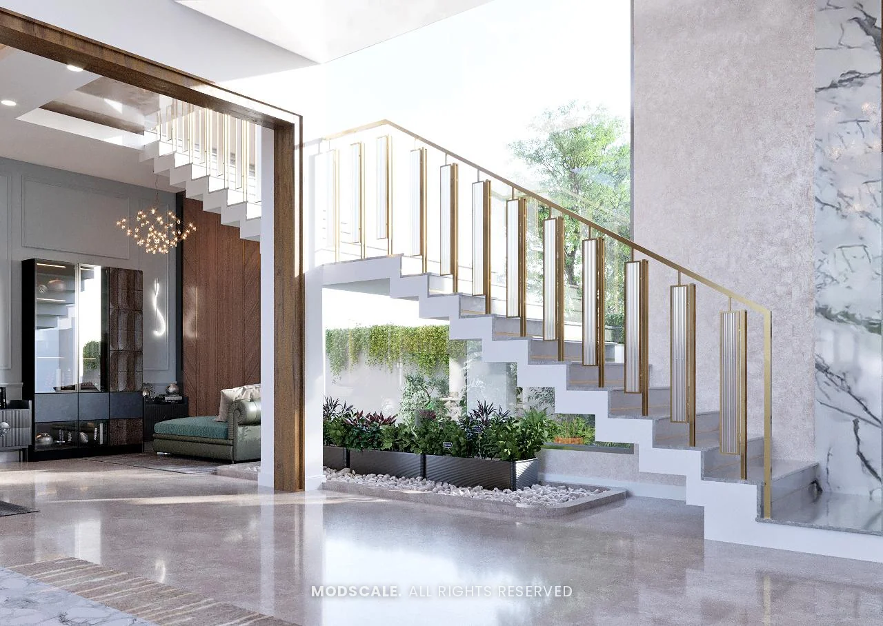 Staircase with brass and glass railing over a planted court, beside a marble wall, Shankar’s villa interior at Royal Meridian Layout, Begur, Bengaluru
