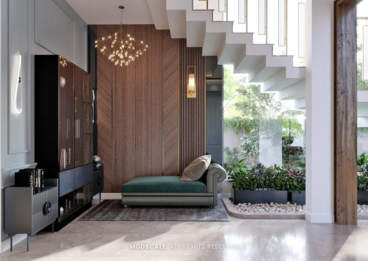 Seating nook under the staircase with green chaise, chevron wood panelling and display unit, Shankar’s villa interior at Royal Meridian Layout, Begur, Bengaluru