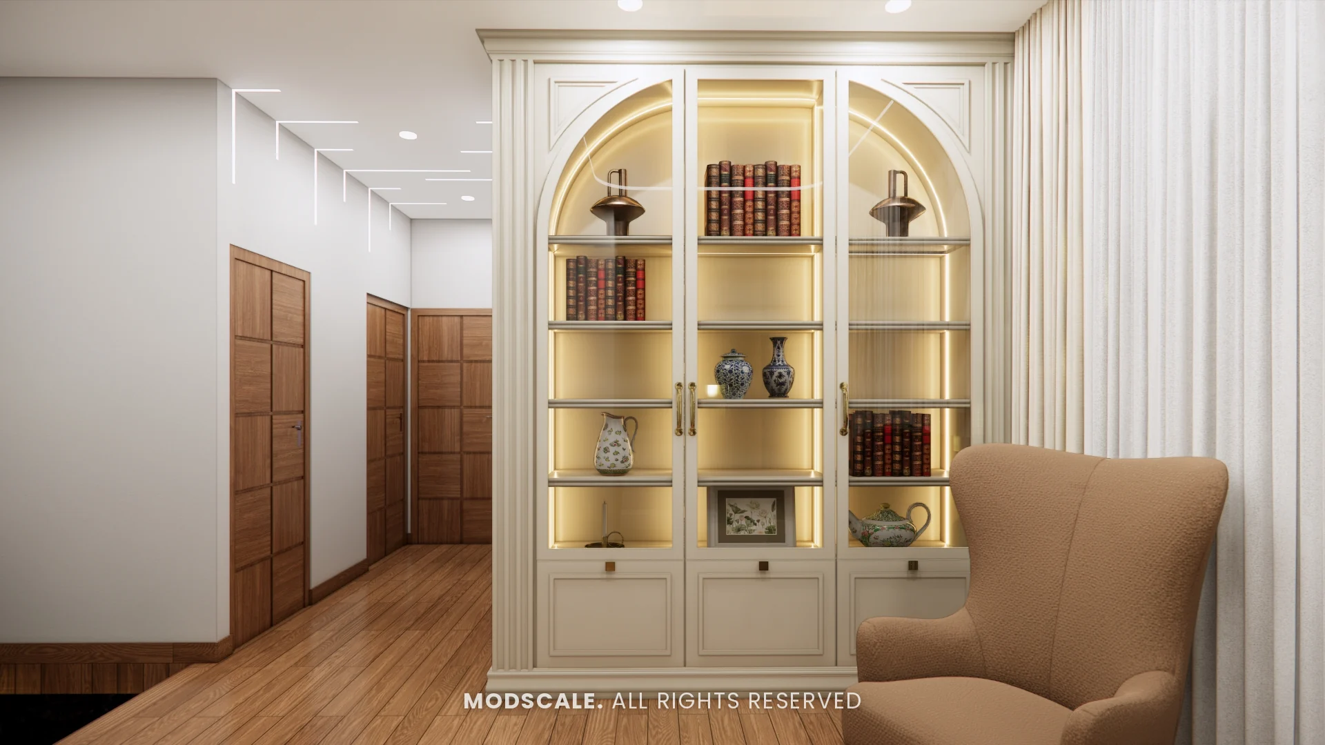 Library bookcase with arched glass doors, warm internal lighting and wing chair, Sugam’s villa interior at The Lake View Address, Electronic City